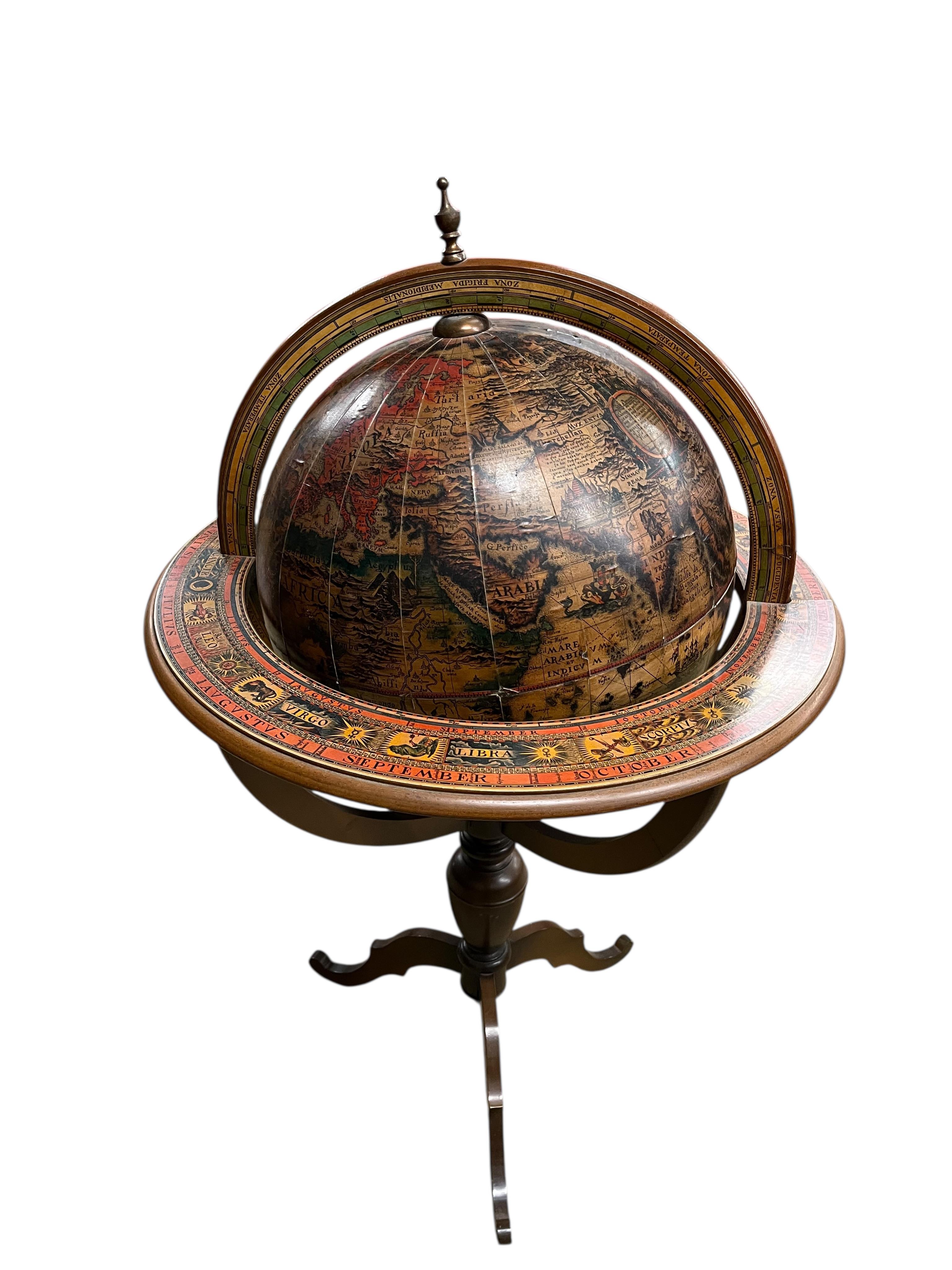 A reproduction terrestrial globe on beech tripod, height 118cm
